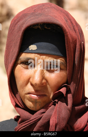 Nomad Berber woman in traditional clothing high in the Atlas Mountains Morocco Stock Photo
