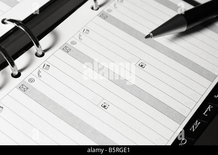 Open organizer with pen Blank page Stock Photo
