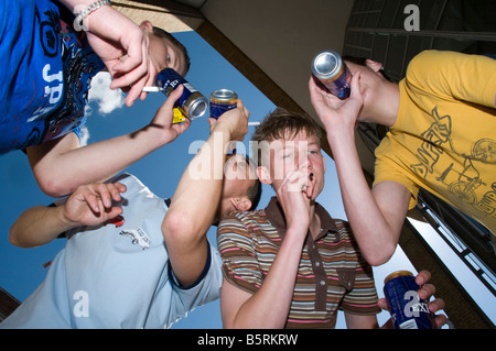 group of teenage boys drinking and smoking Stock Photo - Alamy