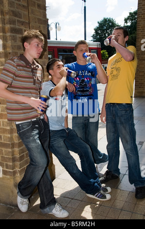 group of teenage boys drinking cans of beer Stock Photo - Alamy