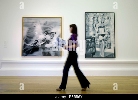 Gerhard Richter on of the most influential European artists of the last fifty years, girl walking past 2 Richter paintings Stock Photo