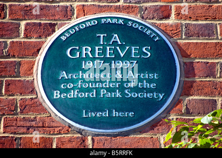 plaque marking a former home of architect, artist and society founder t .a. greeves, in bedford park, chiswick, london, england Stock Photo