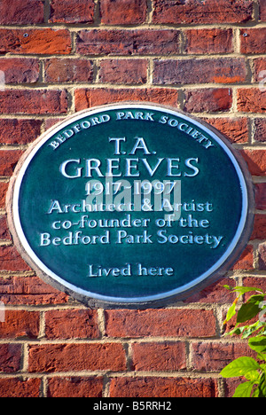 plaque marking a former home of architect, artist and society founder t .a. greeves, in bedford park, chiswick, london, england Stock Photo