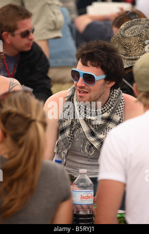 Glastonbury Festival June 2008 young festival pop music fans enjoy the outdoor festival Stock Photo