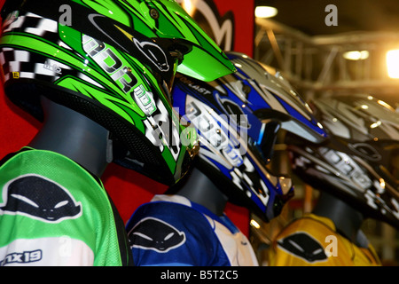 Motocross racing suits with helmets Stock Photo