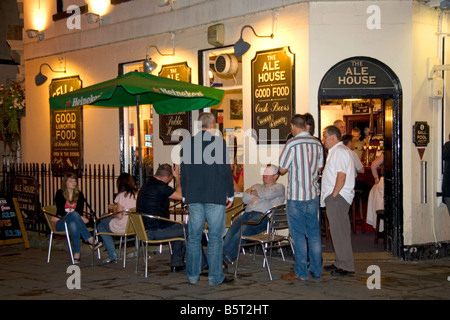 Customers socialize in front of The Ale House pub in the city of Bath Somerset England Stock Photo