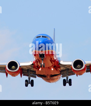 commercial jet airplane landing at an airport Stock Photo