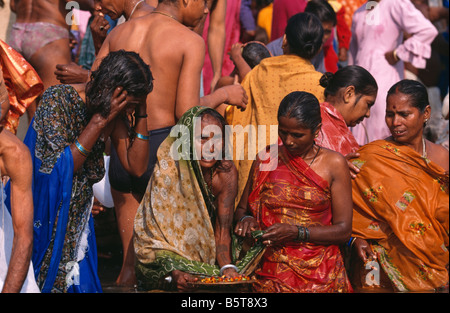 Women in the river Ganges at Varanasi during the Kartik Purnima festival in India Stock Photo