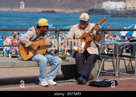 Busker playing classical guitar near Las Canteras beach in Las Palmas on Gran Canaria in The Canary islands. Stock Photo