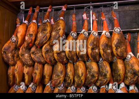 Spanish hams Jamones at a meat stall in the central market Mercado Central in the historical city centre of Valencia Spain Stock Photo