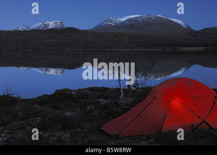 Tent on a lake in Abisko National Park with shiny lapp gate (Lapporten), Norrbotten, Lapland, Sweden, Scandinavia, Europe, Stock Photo