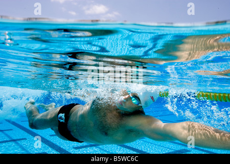 Swimmer performing Freestyle Stroke Stock Photo