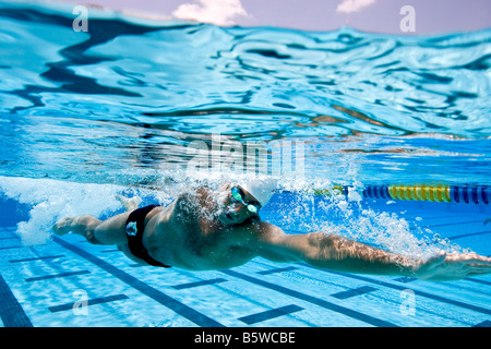 Swimmer performing Freestyle Stroke Stock Photo