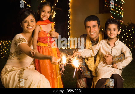 Family celebrating diwali Stock Photo