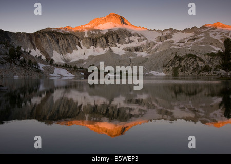 Early light on Glacier Peak reflected in Glacier Lake Eagle Cap Wilderness Wallowa Mountains Oregon Stock Photo