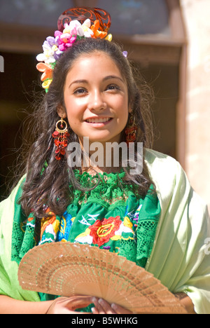 San Antonio Founders Day, young Hispanic woman in traditional dress in San Fernando Cathedral Plaza Stock Photo