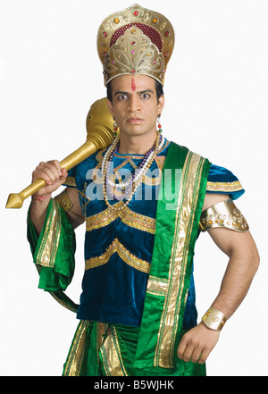 Young man dressed-up as Bhima holding a mace Stock Photo