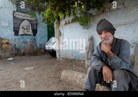 An Egyptian man in the City of the Dead or Cairo Necropolis where some people live and work amongst the dead in southeastern Cairo, Egypt. Stock Photo