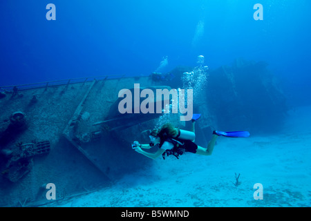 Underwater photographer and shipwreck. Stock Photo