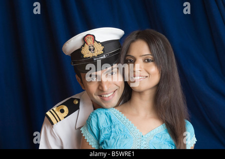 Close-up of a navy officer smiling with a teenage girl Stock Photo