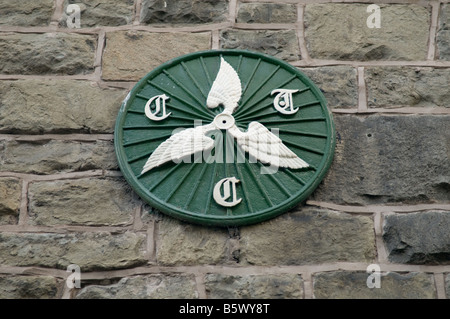 CTC Cyclists Touring Club wheeled wings green painted cast iron sign on building in Builth Wells Powys Wales UK Stock Photo