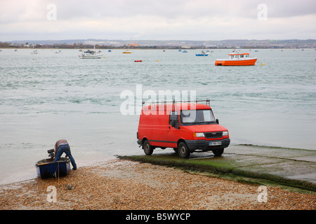 Recovering a dinghy on the slipway at Hayling Island Stock Photo