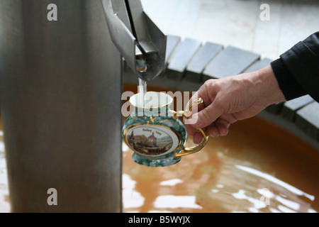 Pouring in the cup. Karlovy Vary Czech Mineral water resort Czech Stock Photo