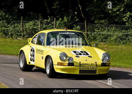1973 Brumos-Porsche 911 RSR IMSA series racer with driver Philip Basil at Goodwood Festival of Speed, Sussex, UK. Stock Photo