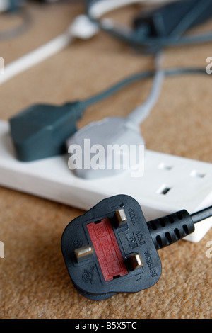 Electric power plugs in a four way adapter Stock Photo