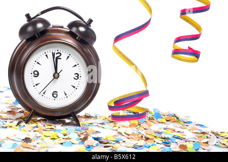 Waiting the New Year with clock confetti and ribbons Shallow depth of field Stock Photo