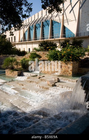 San Antonio's Henry B. Gonzalez Convention Center with HemisFair Park water fall fountain in foreground Stock Photo