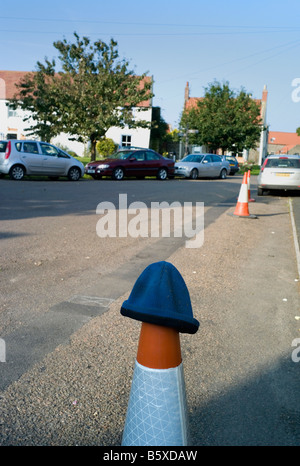 Lost woolly hat on a traffic cone Stock Photo