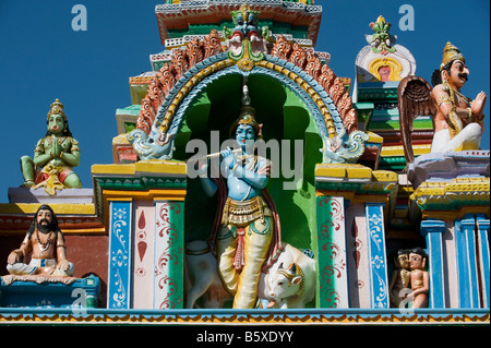 Hindu deity, Lord Krishna, painted statue, on the Lord Lakshmi Narasimha Swamy Temple in Kadiri, Andhra Pradesh, India Stock Photo