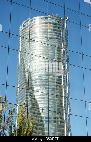 Tower Espacio reflected on glass facade. Madrid. Spain. Stock Photo