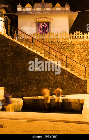 People bathe at the Kadri Manjunatha Temple in Mangalore, India. Stock Photo