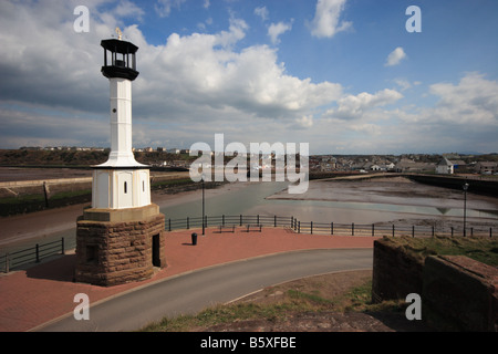 A view of Maryport harbour and lighthouse from the coast Stock Photo