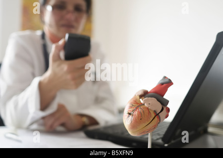 Doctor using a voice tape recorder Stock Photo