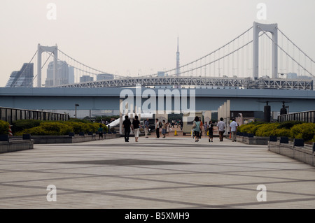 Rainbow Bridge (finished in 1993) and Tokyo Tower in the background, as seen from Odaiba island. Tokyo Bay. Japan. Stock Photo