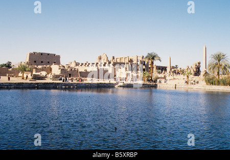 Karnak, near Luxor, Egypt, View across the Sacred Lake towards the Temple of Amun. Stock Photo