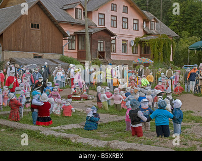 lots of dressed dolls in garden in differenz scenes special attraction in the village Sabile Latvia Baltic states Stock Photo