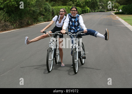 nerd boyfriend and girlfriend enjoy their bikes Stock Photo