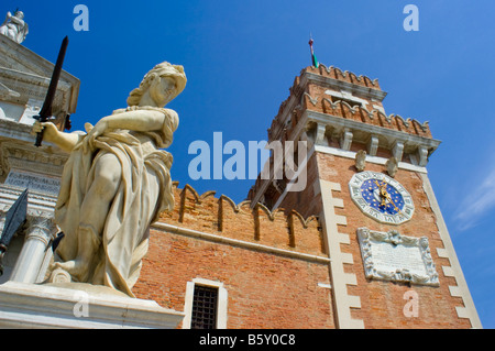 Venice, Veneto, Italy. Statue, and Tower of the Arsenale Stock Photo
