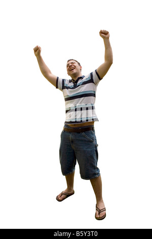 A young man joyously throws his hands up in the air Includes the clipping path Stock Photo