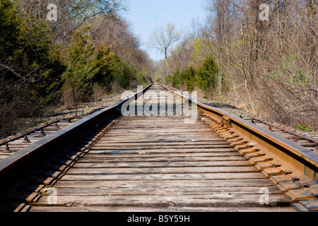 Railroad tracks going off into the distance ahead Stock Photo