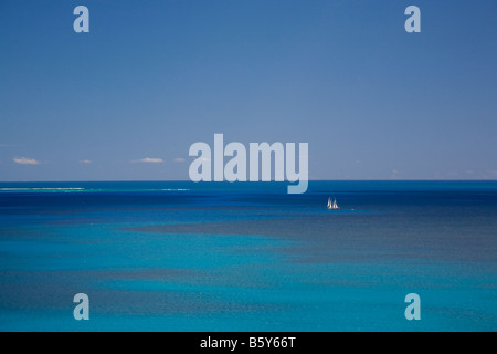 Sailboat in the Caribbean Sea off the island of Anguilla in the British West Indies Stock Photo