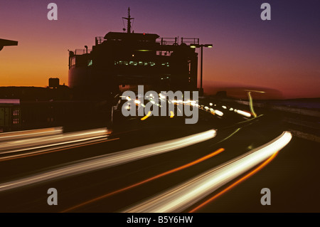 Ferry boat with traffic at sunset Mukilteo Ferry dock Washington State USA Stock Photo