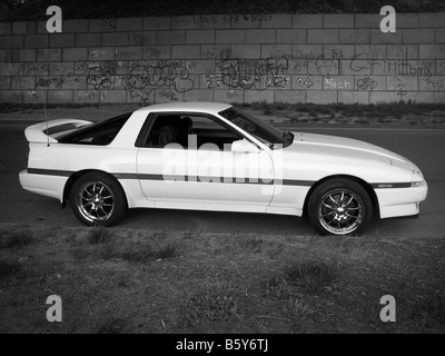 A late model white sports car parked in an urban setting Stock Photo