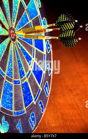 Three darts in center of dart board. Accuracy concept. Stock Photo