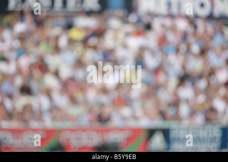 crowd fans spectaters blurred out of focus sports cricket soft background backdrop Stock Photo