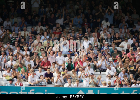 crowd fans spectaters blurred out of focus sports cricket soft background backdrop Stock Photo